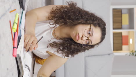 Vertical-video-of-Books-and-unhappy-Female-student.